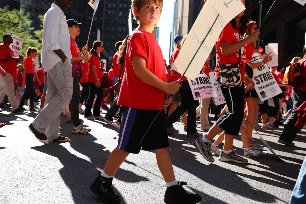Chicago teachers and their supporters rally in Chicago on the second day of the Chicago teacher's strike.