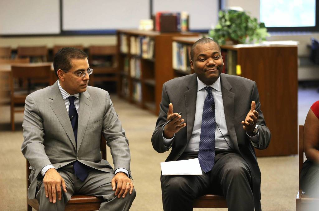 Chicago Schools Superintendent Jean-Claude Brizard (right) speaks as Board of Education Vice President Jesse Ruiz (left) listens in during a round table discussion at Roberto Clemente Community Academy in Chicago.