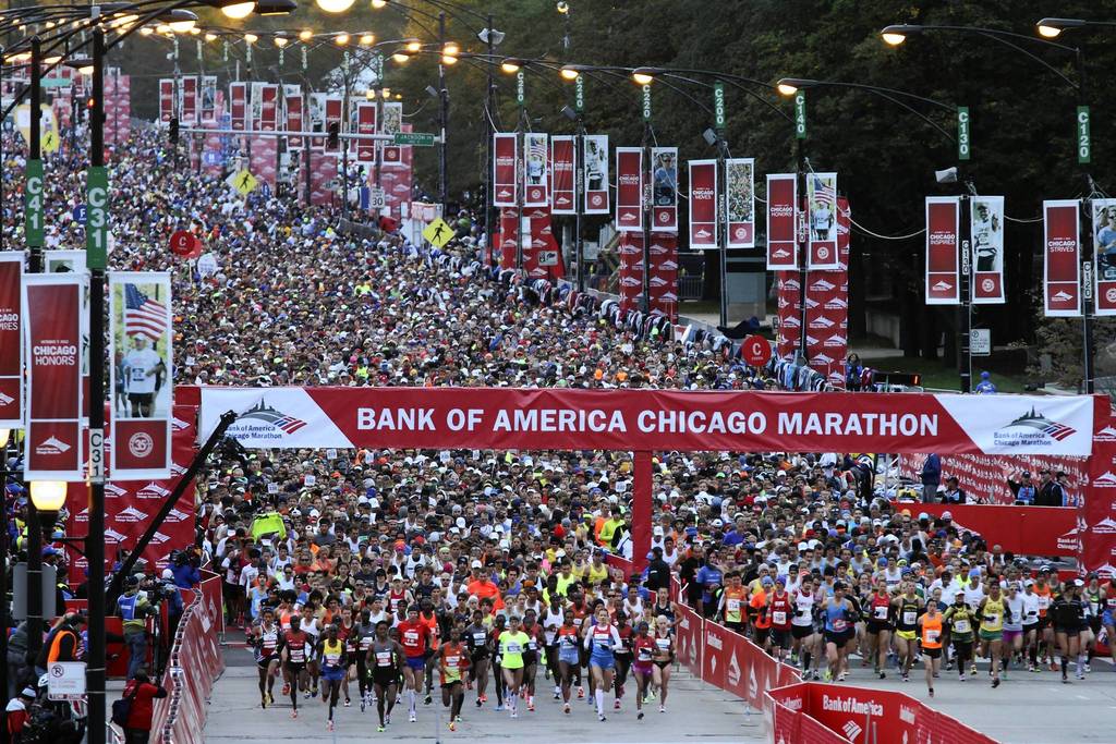 The elite marathoners leave the starting line on Columbus Drive at the start of the Bank of America Chicago Marathon