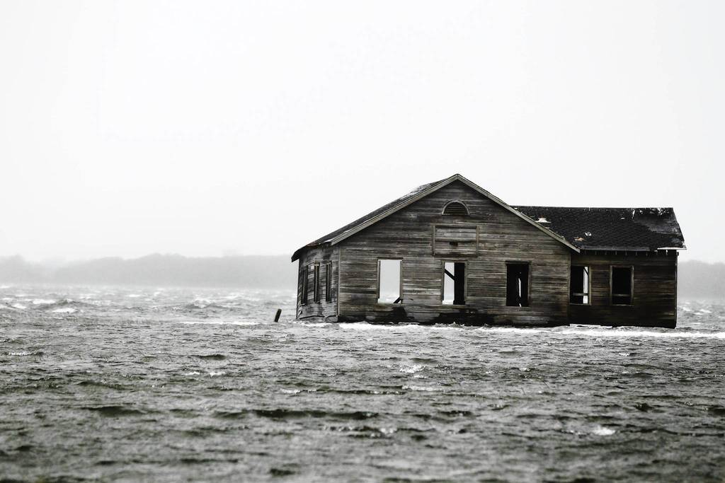 An abandoned home is inundated with water at Shinnecock Bay in Southampton, New York. Hurricane Sandy, the monster storm bearing down on the East Coast, strengthened on Monday after hundreds of thousands moved to higher ground, public transport shut down and the stock market suffered its first weather-related closure in 27 years.