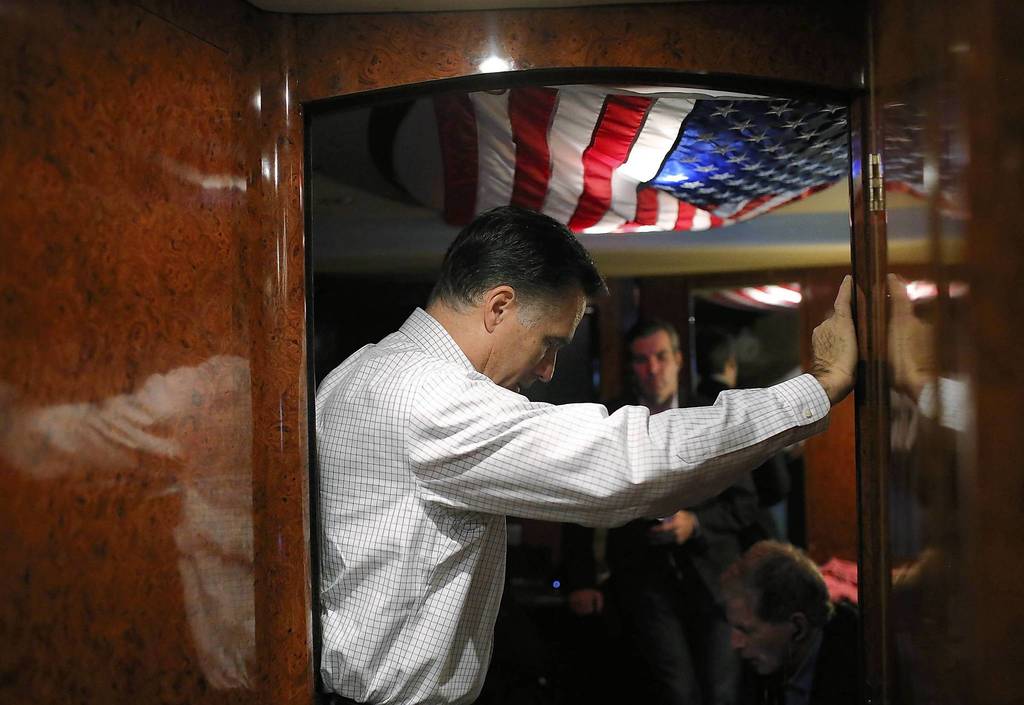 Republican presidential candidate, former Massachusetts Gov. Mitt Romney listens in on conference call with advisers aboard his campaign bus en route to a campaign rally at Avon Lake High School in Avon Lake, Ohio. Romney has canceled other campaign events on October 29 and 30 due to Hurricane Sandy.