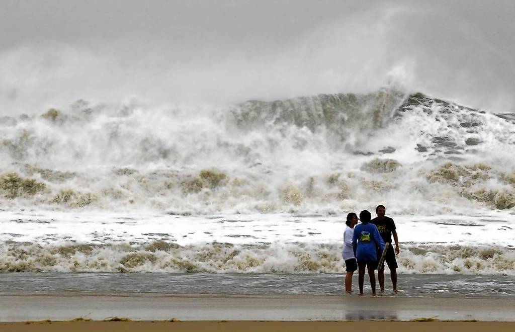A wall of water makes its way to shore as residents take a dip in the big surf in Ocean City, Maryland, as Hurricane Sandy intensifies. About 50 million people from the Mid-Atlantic to Canada were in the path of the nearly 1,000-mile-wide storm, which forecasters said could be the largest to hit the mainland in U.S. history.
