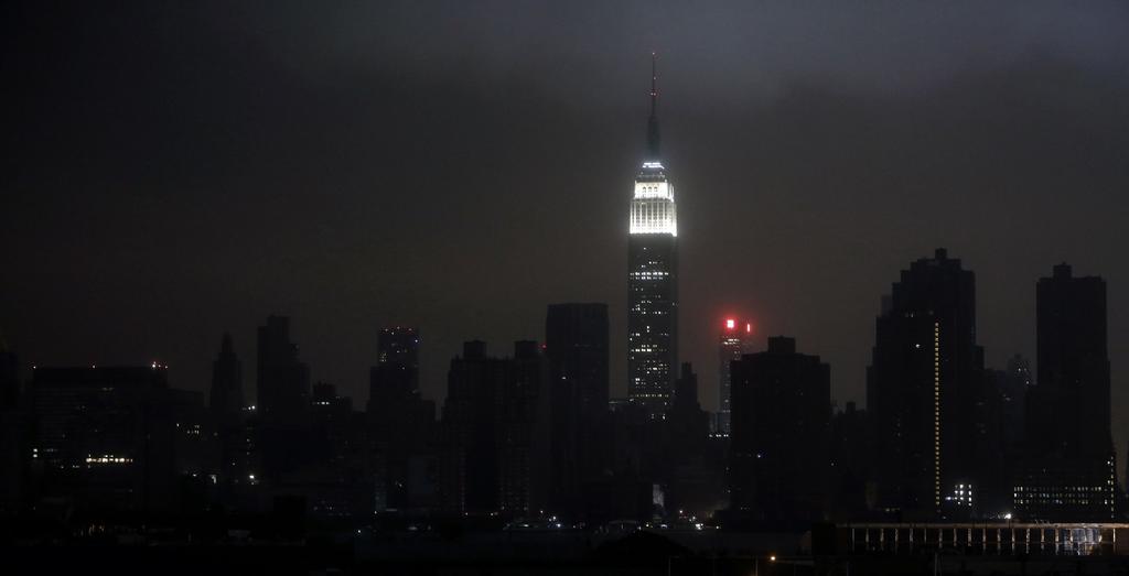 A blacked out New York City skyline is seen from Brooklyn, New York, October 29, 2012 as Hurricane Sandy made landfall in the northeastern United States.