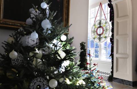 A stained glass window, created by Chicago-based artist David Lee Csicsko, is on display at the East Wing during a preview of the 2012 White House holiday decorations at the White House in Washington, DC.
