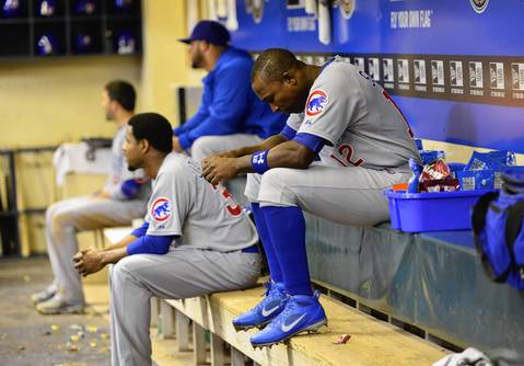 Alfonso Soriano sits in the Cubs' dugout after the sixth inning.