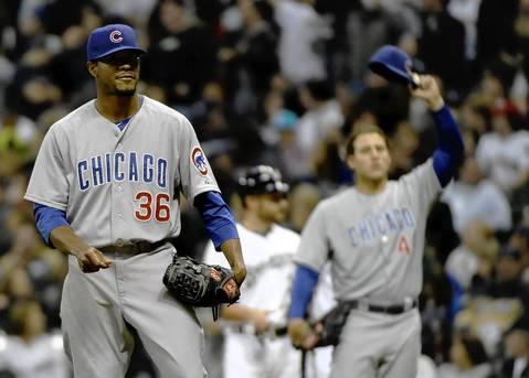 Cubs pitcher Edwin Jackson reacts after his throwing error in the sixth.