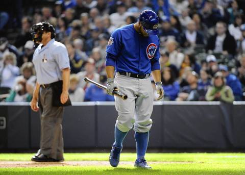 Cubs catcher Welington Castillo walks back to the dugout after striking out in the ninth inning.