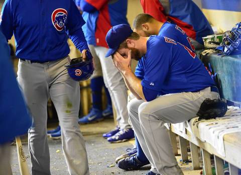 Cubs pitcher Scott Feldman sits in the dugout after the fifth inning.