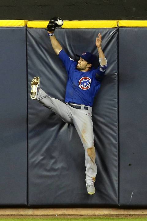 Cubs centerfielder David DeJesus is unable to hold onto the is ball, resulting in a double for Yuniesky Betancourt in the bottom of the fifth.