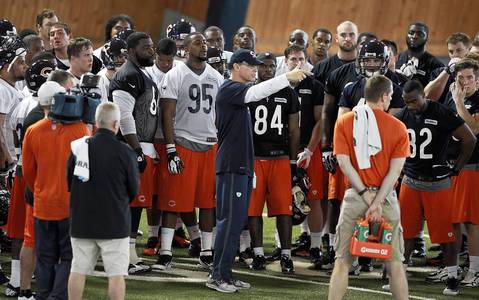 Bears coach Marc Trestman talks to his team at the end of practice on the first day of rookie minicamp.
