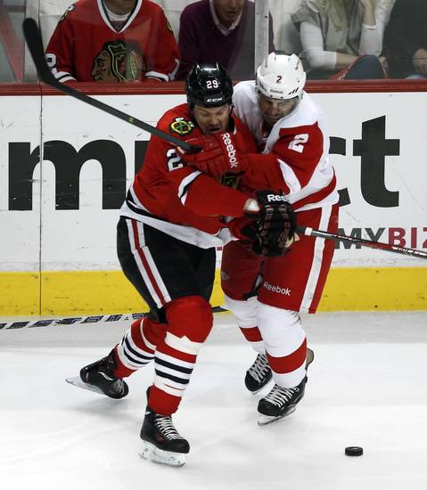 Bryan Bickell tries to get past the Red Wings' Brendan Smith during the first period.