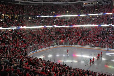The Blackhawks stand at attention during the National Anthem.