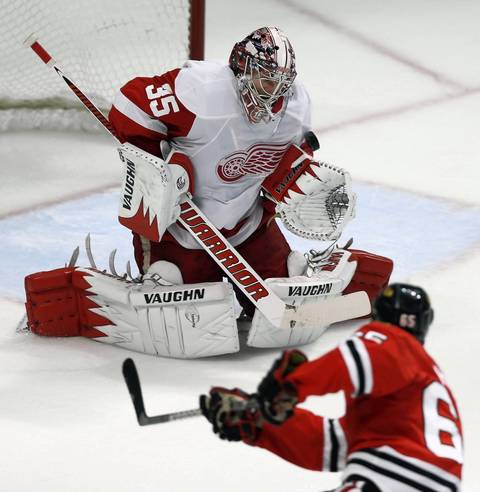Michael Frolik is stopped by Red Wings goalie Jimmy Howard during the second period.