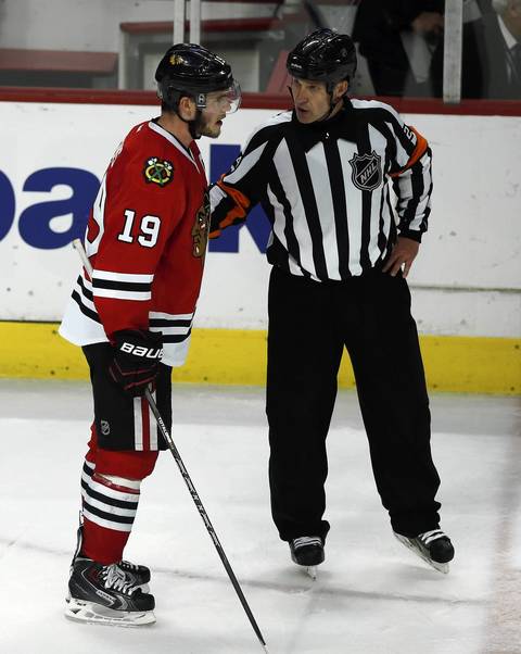 Jonathan Toews talks to a referee after Niklas Hjalmarsson's goal was disallowed in the third period.