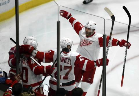 The Red Wings' Daniel Cleary celebrates Henrik Zetterberg's game-tying goal early in the third period.