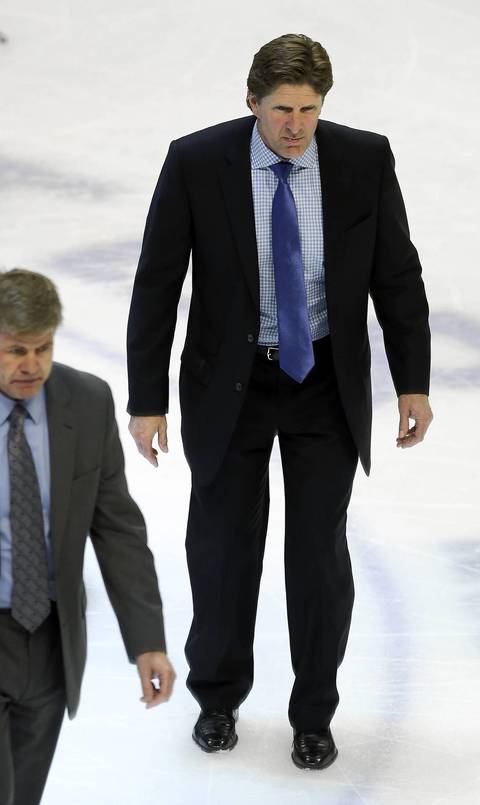 Red Wings coach Mike Babcock walks off the ice after the 2-1 overtime loss.