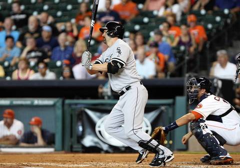 Paul Konerko drives in a run with a single during the first inning.