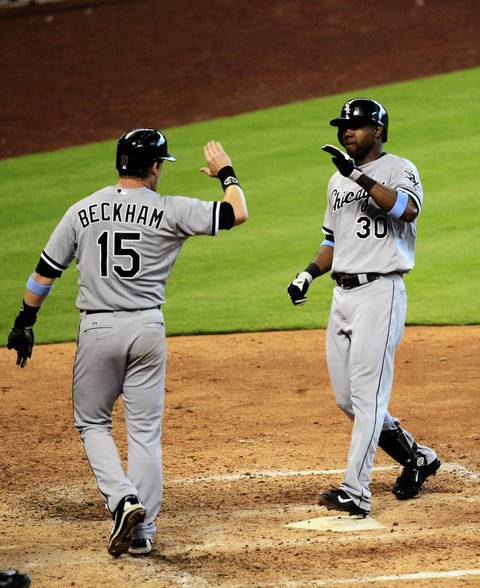 Alejandro De Aza celebrates hitting a two-run home run with Gordon Beckham against the Astros during the ninth inning.
