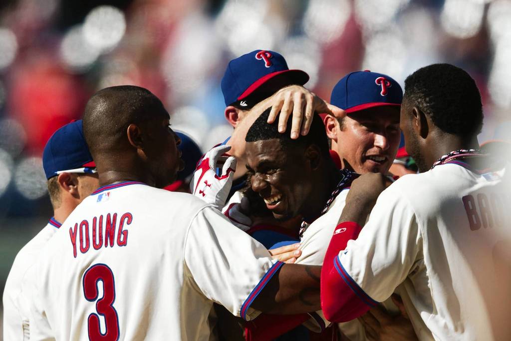 Phillies center fielder John Mayberry celebrates getting the game winning walk-off RBI single with teammates during the 10th inning against the White Sox at Citizens Bank Park.