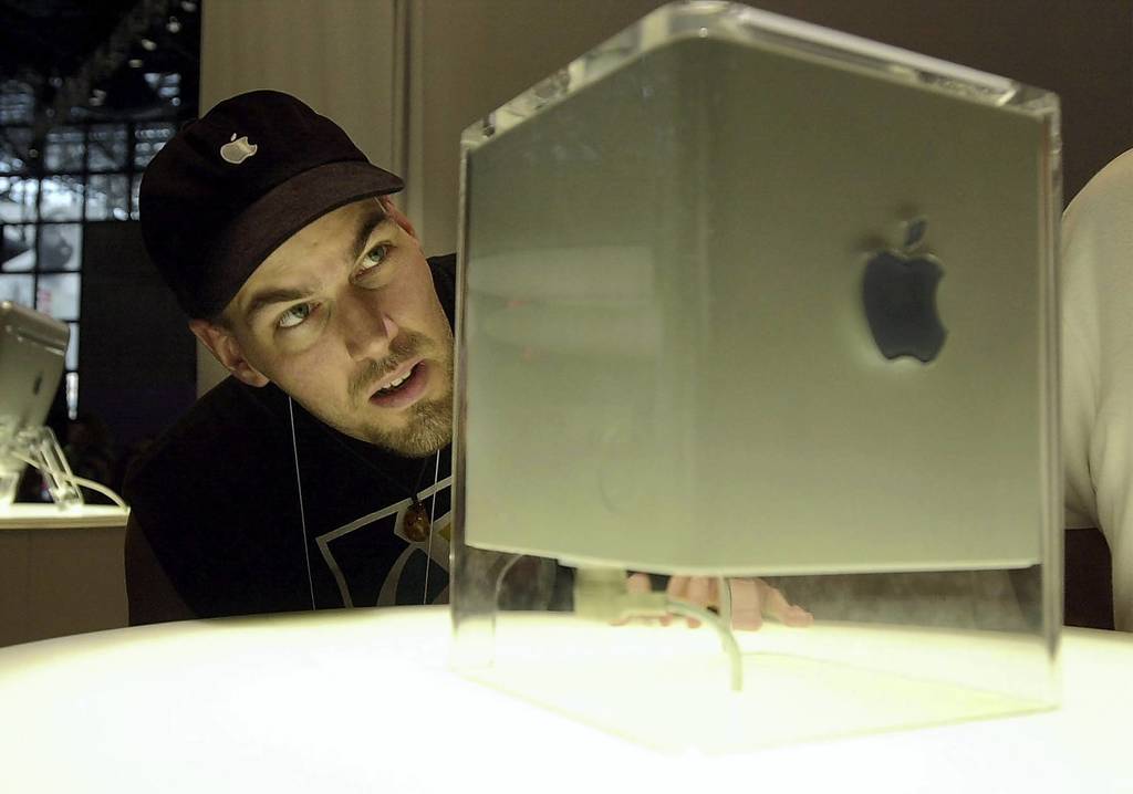 Mark Mineart, of New York, eyes Apple's G4 Cube at the MacWorld Conference and Expo at the Javits Center in New York City. Despite Steve Jobs' public affection for it, it still failed.