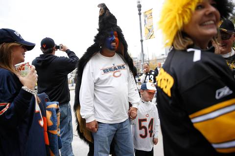Bears fan Kevin Stringfellow and his son Jayden, 6, wait to enter.