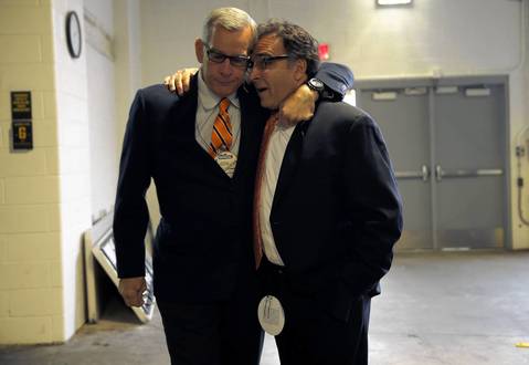 Bears General Manager Phil Emery and President Ted Phillips greet each other before Sunday's game.