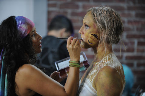 Heather Aguilera dirties the zombie bride's teeth.