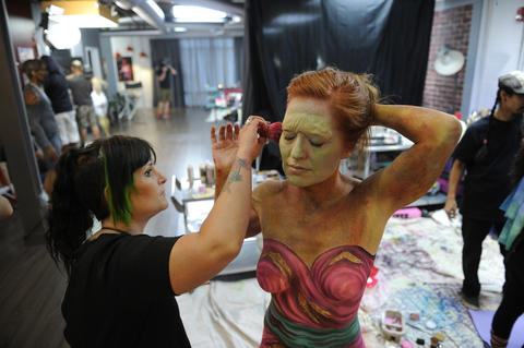 Heather Aguilera applies makeup to a zombie bridesmaid.