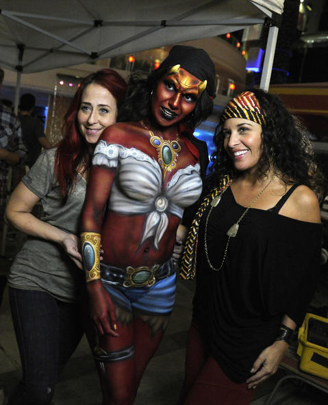 Kelly "Red" Belmonte (left) and Heather Aguilera (right) pose with a model. The devilish pirate will appear in the video for The James Douglas Show's new song "Vegas Hot," which will premiere Nov. 5 when the "Naked Vegas" episode airs.