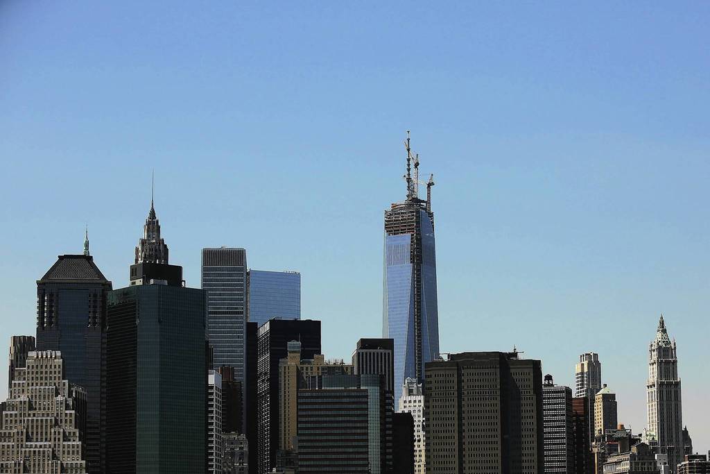 The 408-foot spire is seen after it was hoisted onto a temporary platform on the top of One World Trade Center.