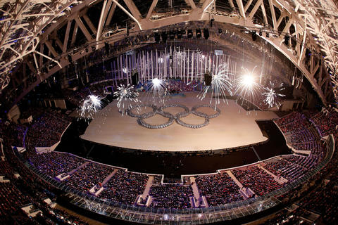 Dancers form the Olympic rings during the 2014 Sochi Winter Olympics Closing Ceremony.