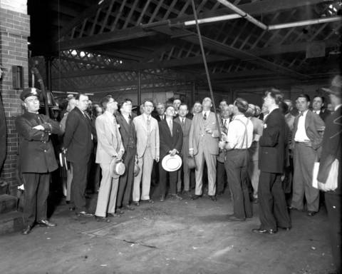 Judge Miller holds court in Porter Brother's Garage at 6231 Princeton Avenue, circa June 26, 1926. Lee Porter shows the court the bullet holes from when Martin Durkin shot and killed FBI Agent Edwin Shanahan on Oct. 11, 1925.