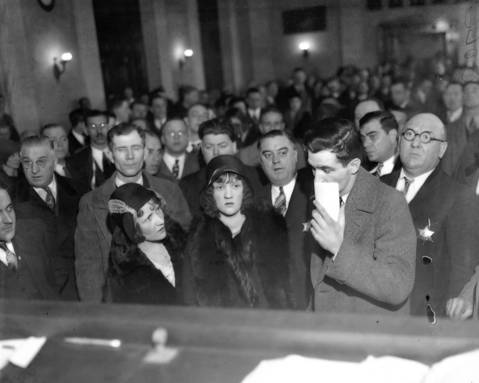 Catherine Behrens, front left, Anna Durkin Downs, and George Downs, before the judge during the Martin Durkin trial, circa Nov. 26, 1930. Durkin shot and killed FBI Agent Edwin Shanahan.