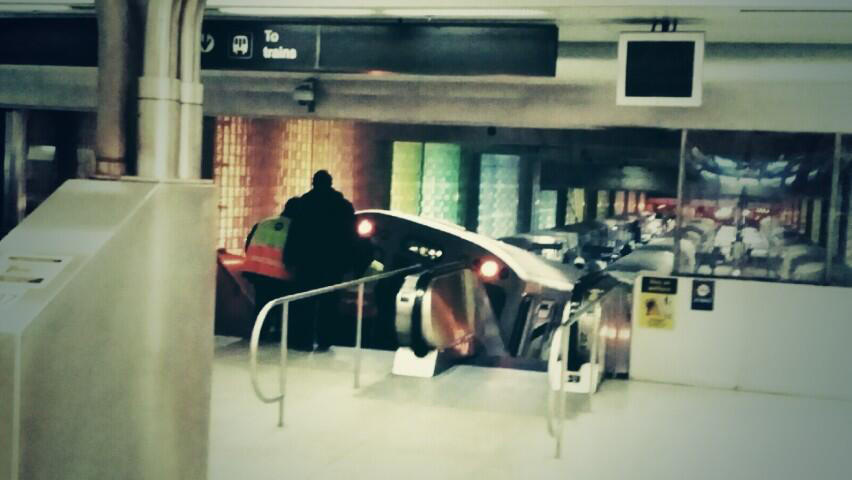 A Blue Line train sits at the bottom of an escalator after it derailed at O'Hare International Airport this morning.