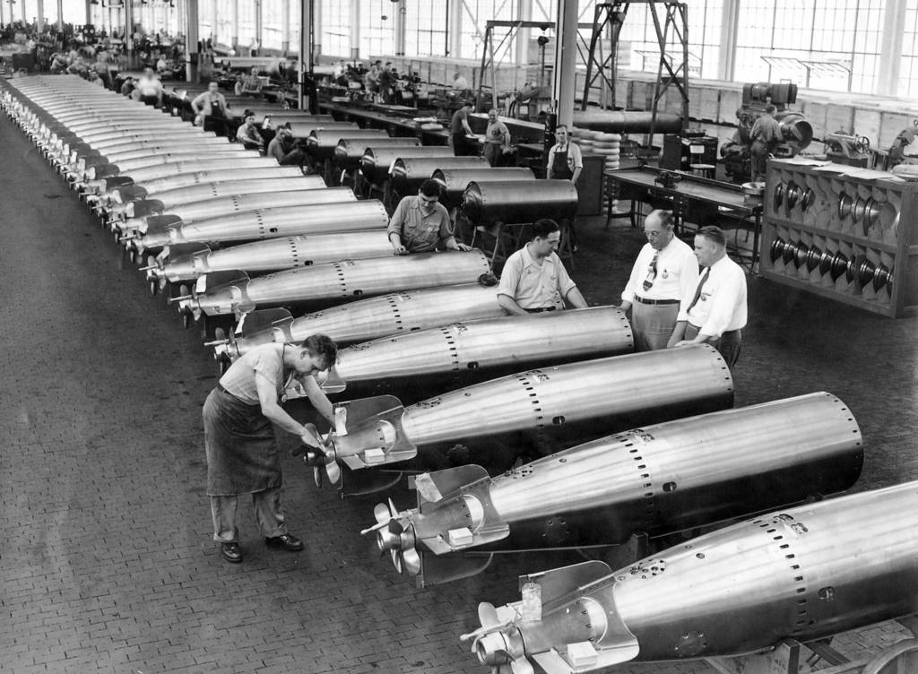 On July 5, 1943 inside the Amertorp Torpedo Ordnance Corporation's $20,000,000 factory in Forest Park, Ill., row upon row of shiny torpedoes are turned out for the Navy.