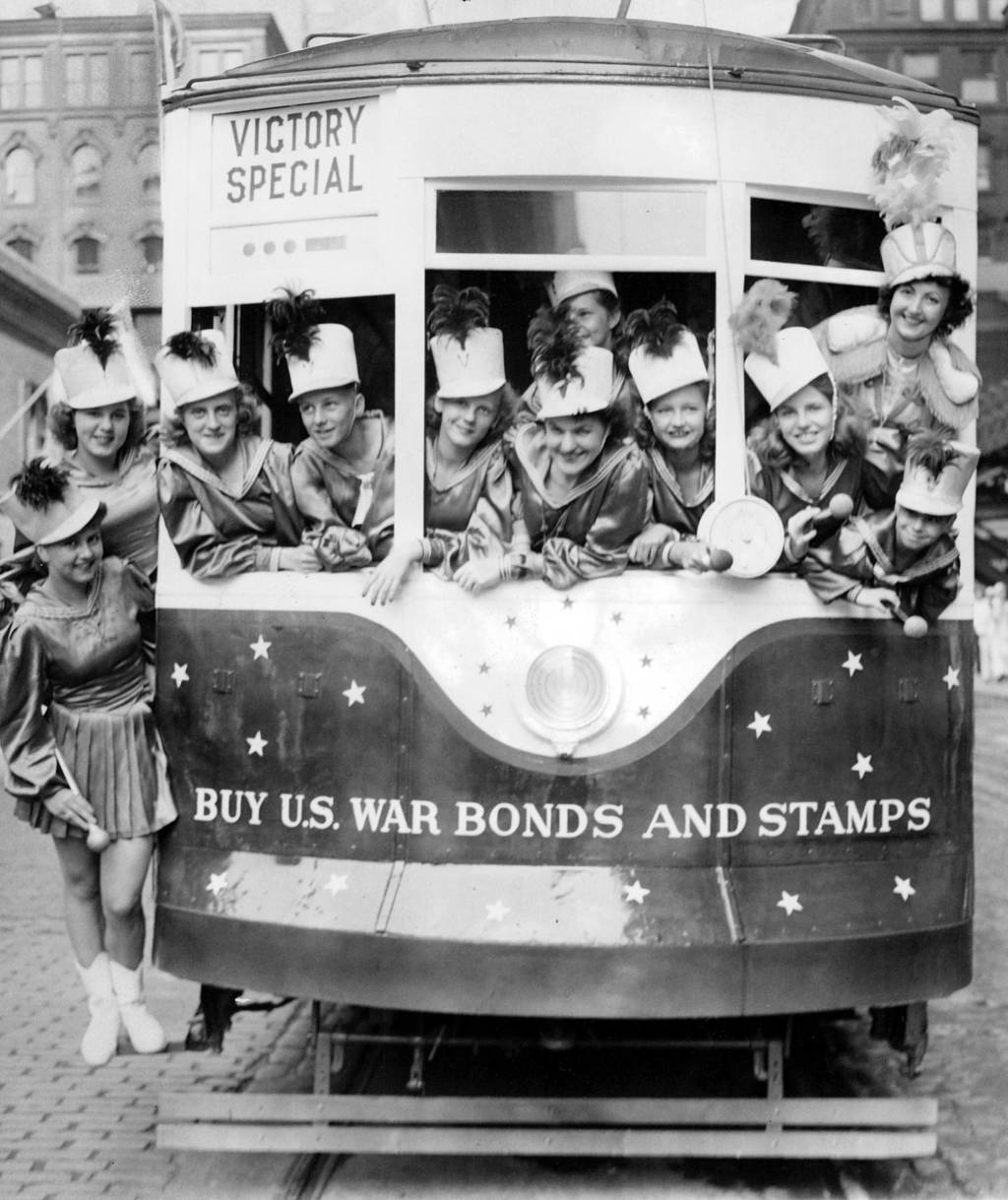 In July 1942, majorettes filled a street car painted red, white and blue to promote the sale of war bonds and stamps during World War II. The car was to go into regular service the next day on the Broadway Line.