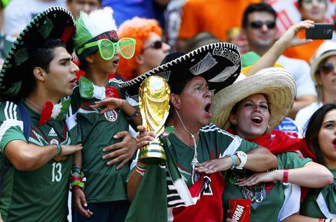 Fans of Mexico sing the national anthem before their 2014 World Cup round of 16 game against the Netherlands at the Castelao arena in Fortaleza.