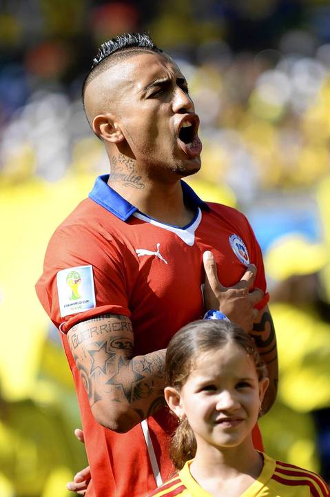 Arturo Vidal of Chile sings the national anthem before the FIFA World Cup 2014 round of 16 match between Brazil and Chile at the Estadio Mineirao in Belo Horizonte, Brazil.