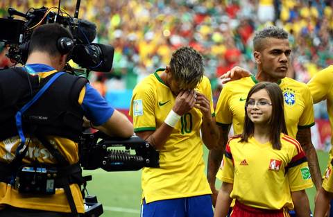 Brazil's forward Neymar cries as Brazil's national anthem is played before a Group A football match between Brazil and Mexico in the Castelao Stadium in Fortaleza.