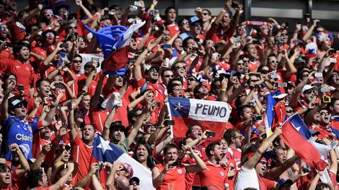 Chile fans sing their national anthem before the Round of 16 football match between Brazil and Chile at The Mineirao Stadium in Belo Horizonte.