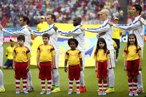 United States players sing the National Anthem before the 2014 FIFA World Cup Brazil group G match between the United States and Germany at Arena Pernambuco in Recife.