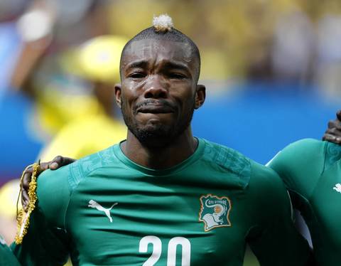Ivory Coast midfielder Geoffroy Serey Die cries during the national anthem before the Group C football match between Colombia and Ivory Coast at the Mane Garrincha National Stadium in Brasilia.