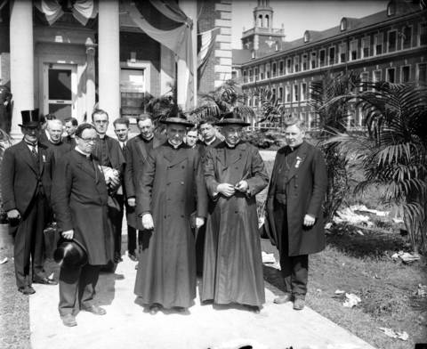 Msgr. C. J. Quille, general secretary of the congress, front row from left, Cardinal Bonzano, Cardinal Mundelein, and Bishop Edward F. Hoban, honorary president of the congress, circa 1926. The group gathered in Chicago for the 28th International Eucharistic Congress held at Soldier Field in June of 1926.