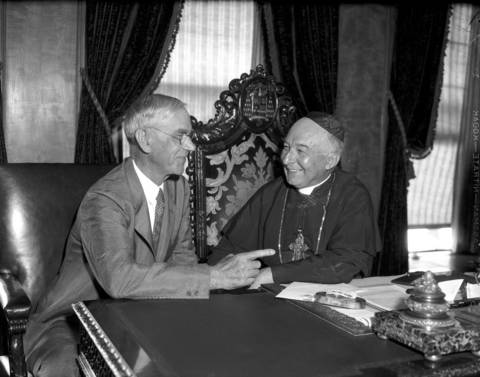 Sen. Reed Smoot of Utah, left, talks with Cardinal Mundelein on Aug. 18, 1932 in Chicago. Sen. Smoot, a Mormon, was in town to discuss welfare for youth. According to the Tribune, Sen. Smoot was impressed with Cardinal Mundelein's work with the Chicago Catholic Youth organization.