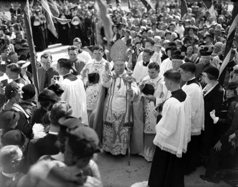 Cardinal George Mundelein, center, at church in Mundelein, Ill., circa Sept. 23, 1935.