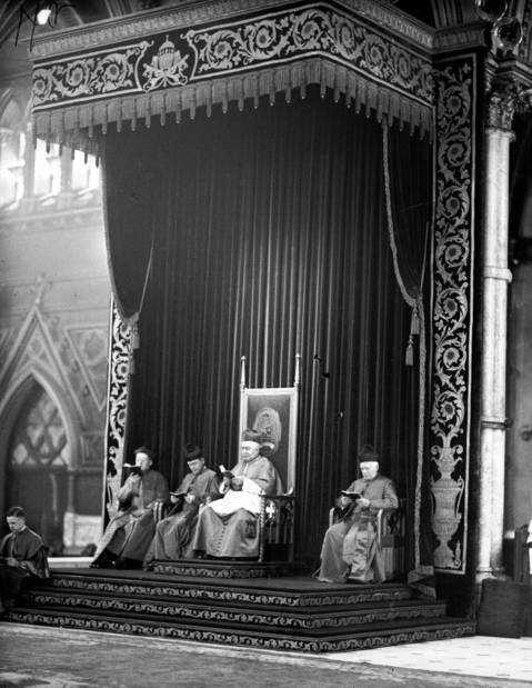Cardinal Mundelein is shown seated on his thrown at the left side of the main alter at Holy Name Cathedral, circa April 8, 1939. Mundelein had just returned from his trip to Rome where he participated in the election of Pope Pius XII. Mundelein would die in his sleep six-months after his return.