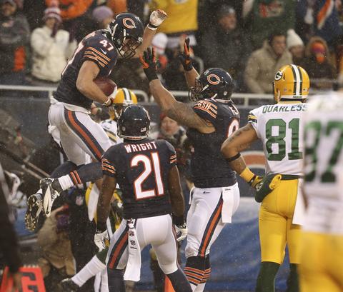 Bears free safety Chris Conte (47) celebrates his interception with teammates during a game against the Green Bay Packers on Dec. 29.