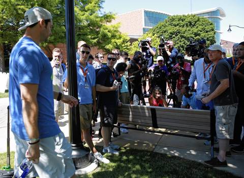 Jay Cutler approaches awaiting reporters at Bears training camp.