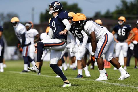 Robbie Gould follows through on his kick off during special teams drills.