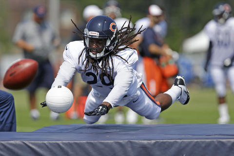 Bears strong safety Danny McCray dives for a ball during special teams drills.